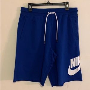 NIKE  blue knee length athletic shorts size L.